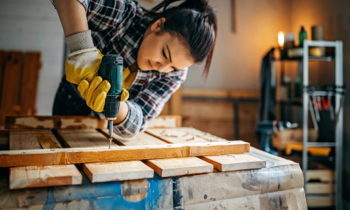 Woman using power drill